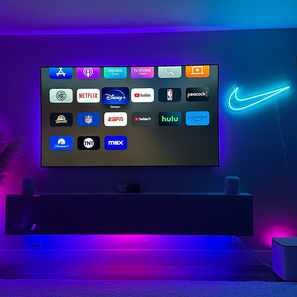 ice blue nike swoosh logo neon sign hanging on living room wall next to tv