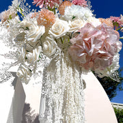 cream amaranthus hanging down white vase within colourful flower arrangement