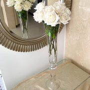 real touch white roses placed in tall wedding glass vase