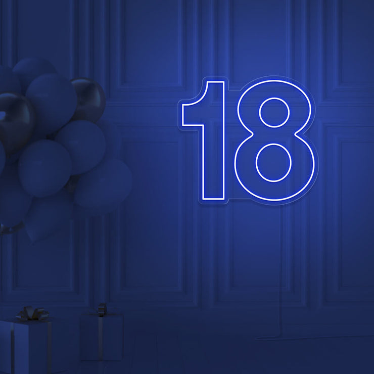 blue 18 neon sign hanging on wall with balloons