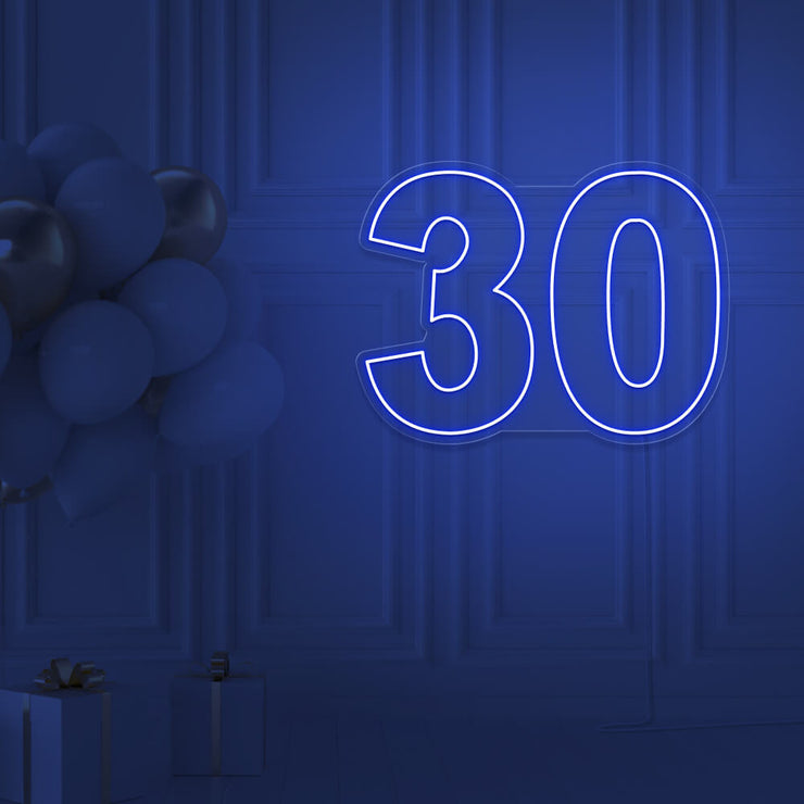 blue 30 neon sign hanging on wall with balloons