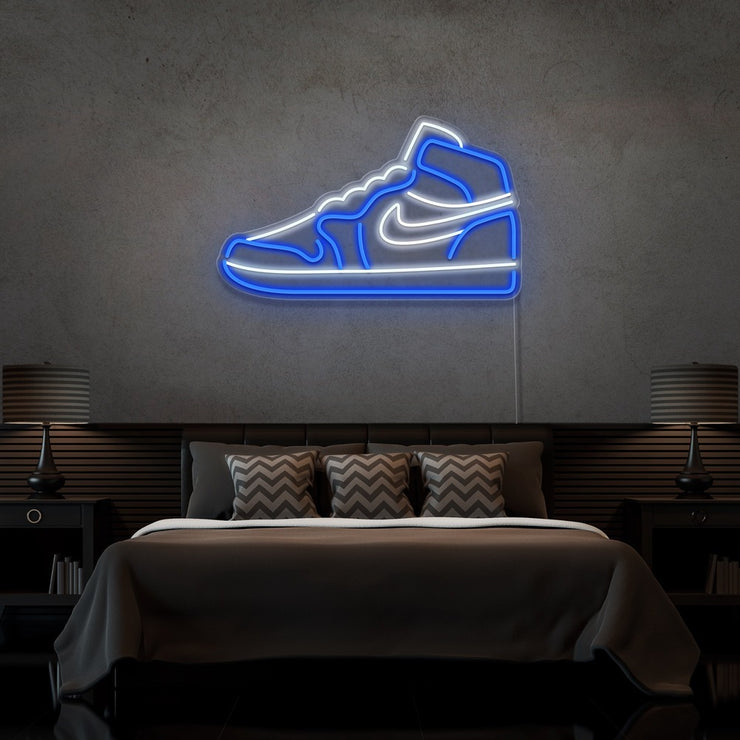 blue air jordan 1 sneaker neon sign hanging on bedroom wall