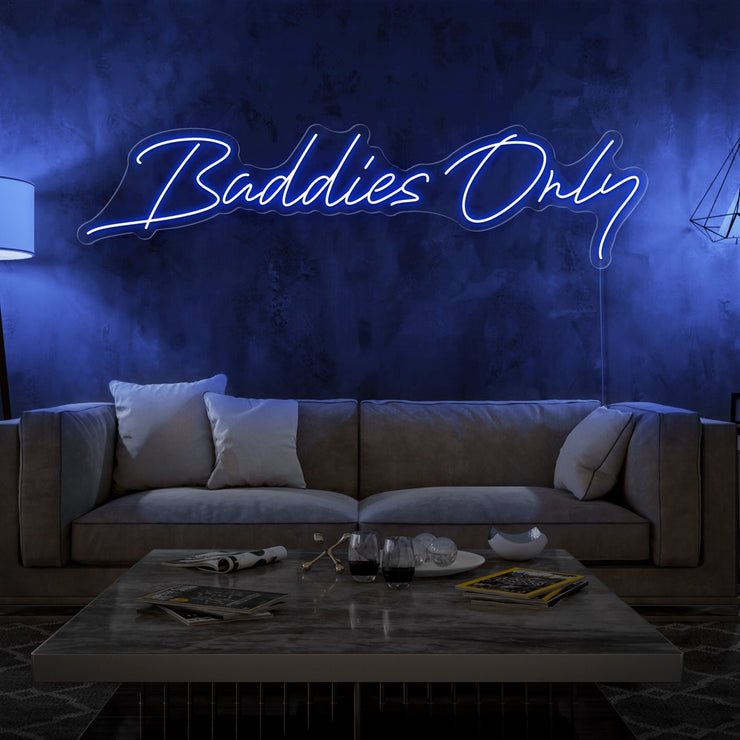 blue baddies only neon sign hanging on living room wall