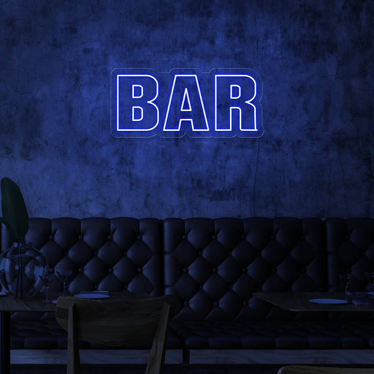blue bar neon sign hanging on bar wall