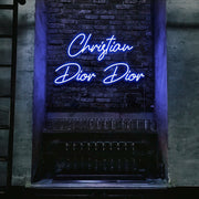 blue christian dior dior neon sign hanging on bar wall