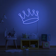 blue crown neon sign hanging on kids bedroom wall