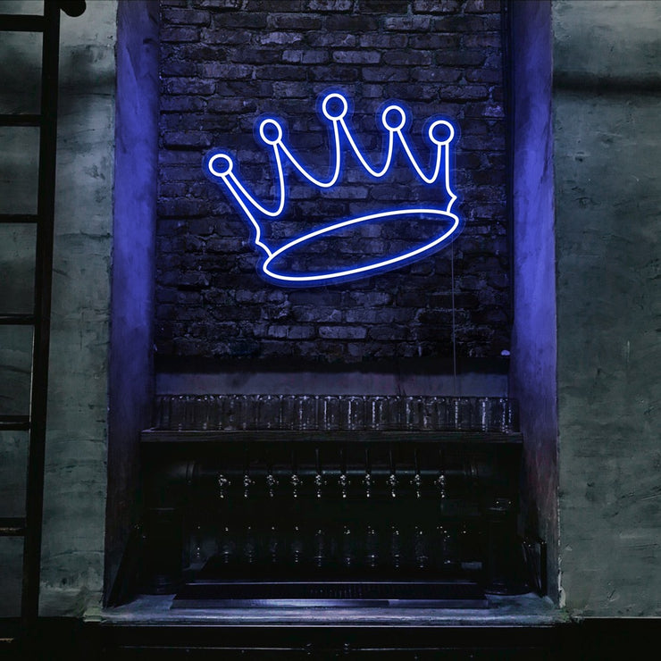 blue crown neon sign hanging on bar wall