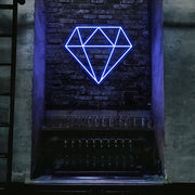 blue diamond neon sign hanging on bar wall