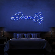 blue dream big neon sign hanging on bedroom wall