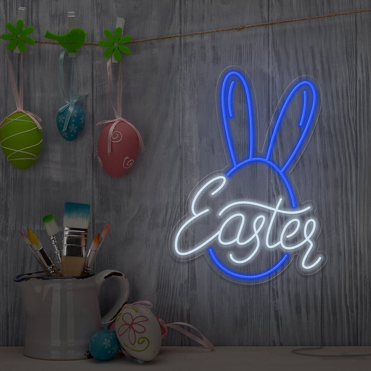 blue easter bunny neon sign hanging on wall