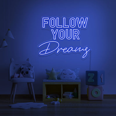 blue follow your dreams neon sign hanging on kids bedroom wall