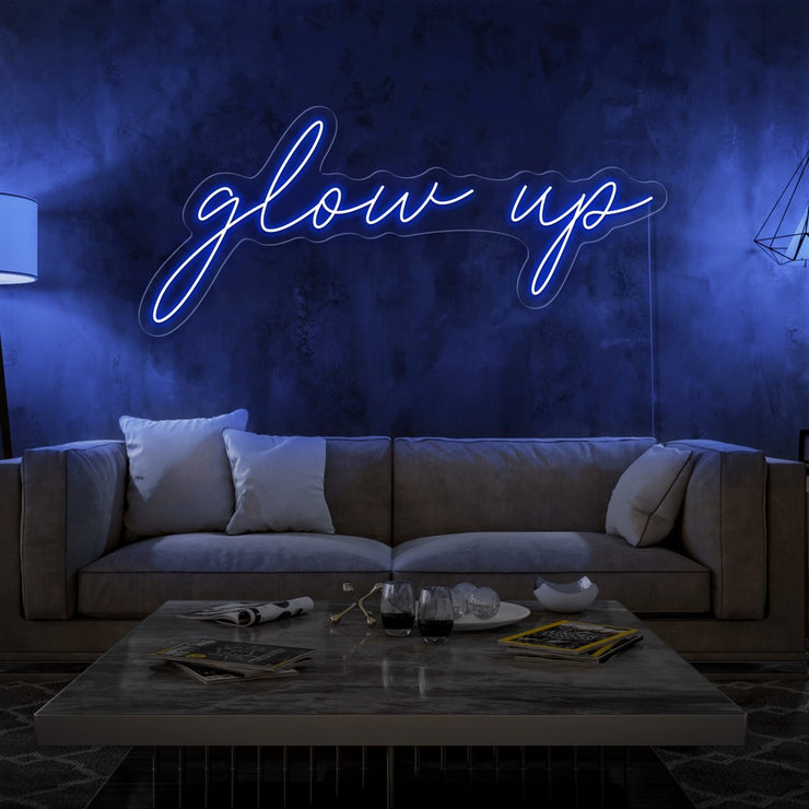 blue glow up neon sign hanging on living room wall