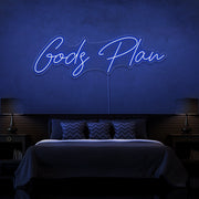 blue gods plan neon sign hanging on bedroom wall