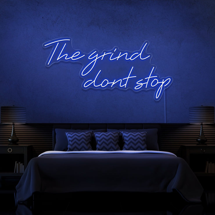 blue the grind dont stop neon sign hanging on bedroom wall