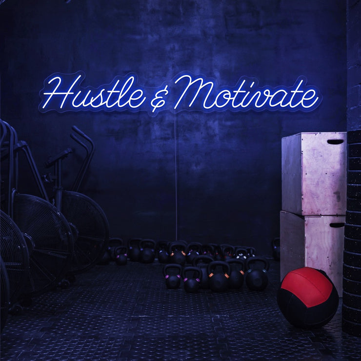 blue hustle and motivate neon sign hanging on gym wall