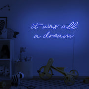 blue it was all a dream neon sign hanging on kids bedroom wall