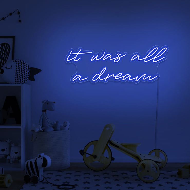 blue it was all a dream neon sign hanging on kids bedroom wall