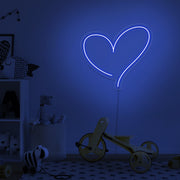 blue love heart neon sign hanging on kids bedroom wall