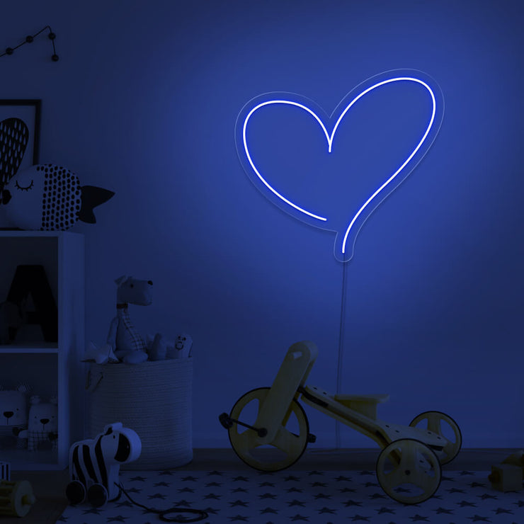 blue love heart neon sign hanging on kids bedroom wall