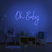 blue oh baby neon sign hanging on kids bedroom wall