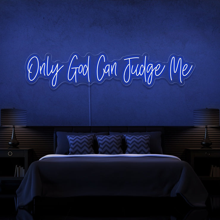 blue only god can judge me neon sign hanging on bedroom wall