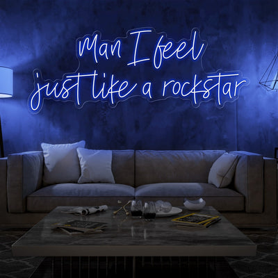 blue man i feel just like a rockstar neon sign hanging on living room wall