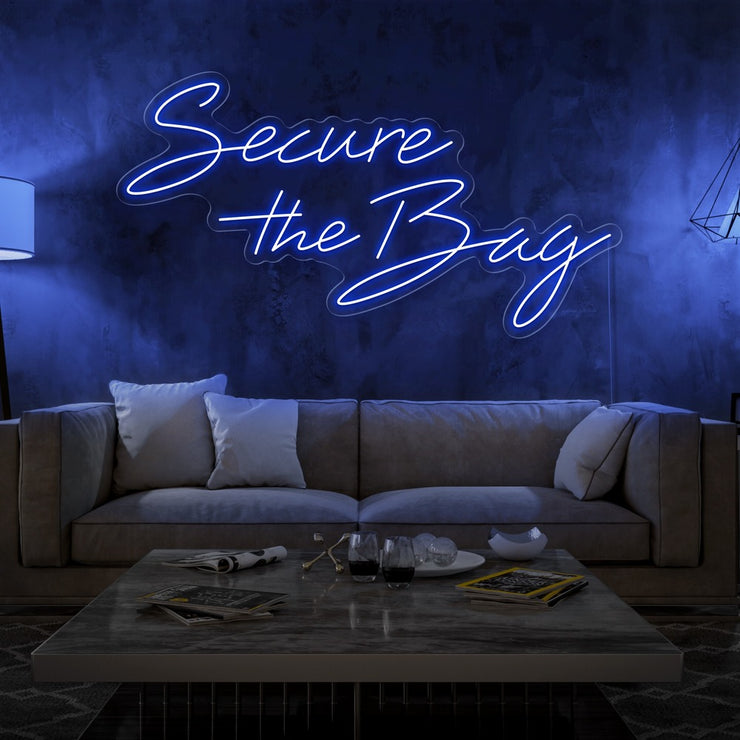 blue secure the bag neon sign hanging on living room wall