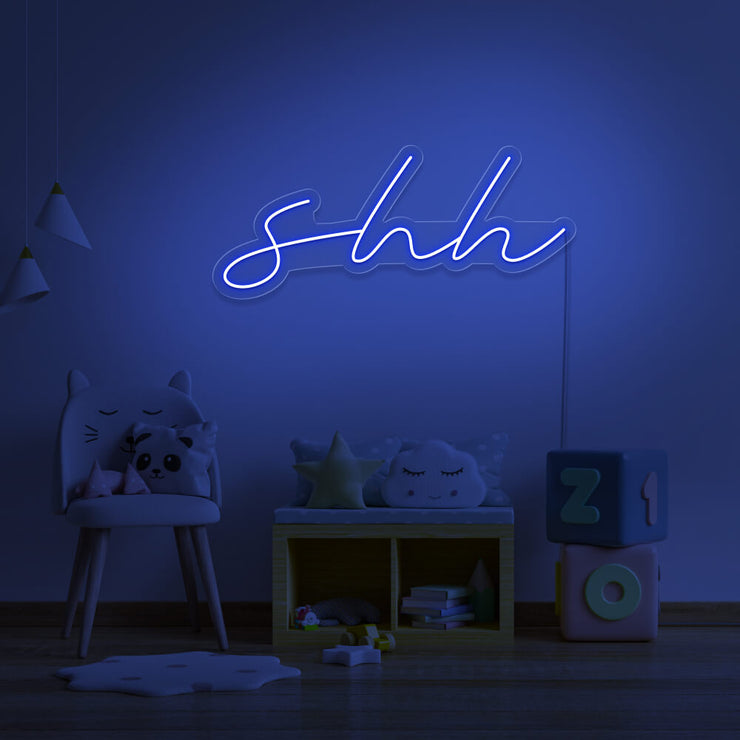 blue shh neon sign hanging on kids bedroom wall