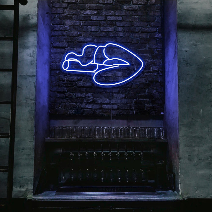 blue smoking lips neon sign hanging on bar wall