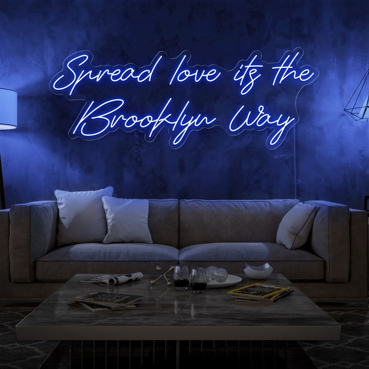 blue spread love the brooklyn way neon sign hanging on living room wall