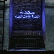 blue im talking wap wap wap neon sign hanging on bar wall