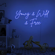 blue young wild and free neon sign hanging on kids bedroom wall