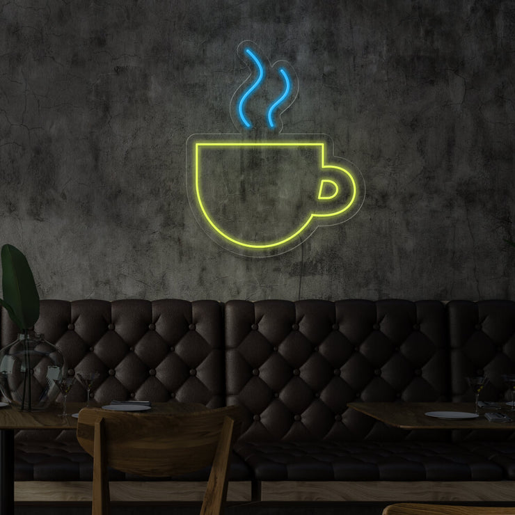 yellow coffee cup neon sign hanging on cafe wall