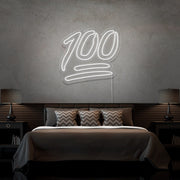 cold white 100 neon sign hanging on bedroom wall