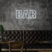 cold white bar neon sign hanging on bar wall