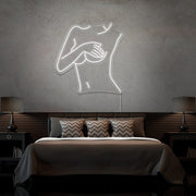 cold white cover up neon sign hanging on bedroom wall