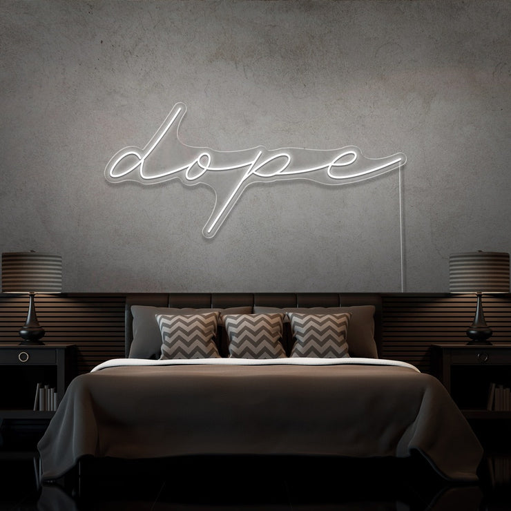 cold white dope cursive neon sign hanging on bedroom wall