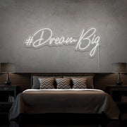 cold white dream big neon sign hanging on bedroom wall
