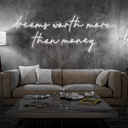 cold white dreams worth more than money neon sign hanging on living room wall