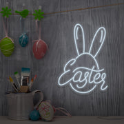 cold white easter bunny neon sign hanging on wall