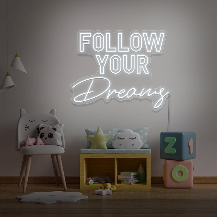 cold white follow your dreams neon sign hanging on kids bedroom wall