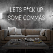 cold lets fuck up commas neon sign hanging on living room wall