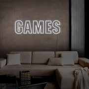cold white games neon sign hanging on games room wall