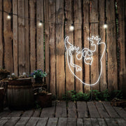 cold white ghost neon sign hanging on timber wall