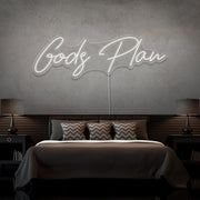 cold white gods plan neon sign hanging on bedroom wall