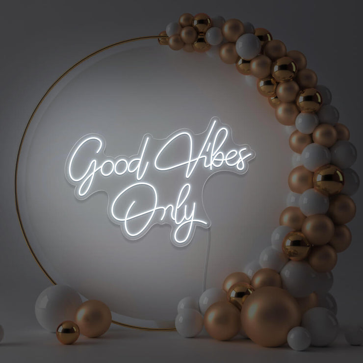 cold white good vibes only neon sign hanging inside balloon hoop backdrop