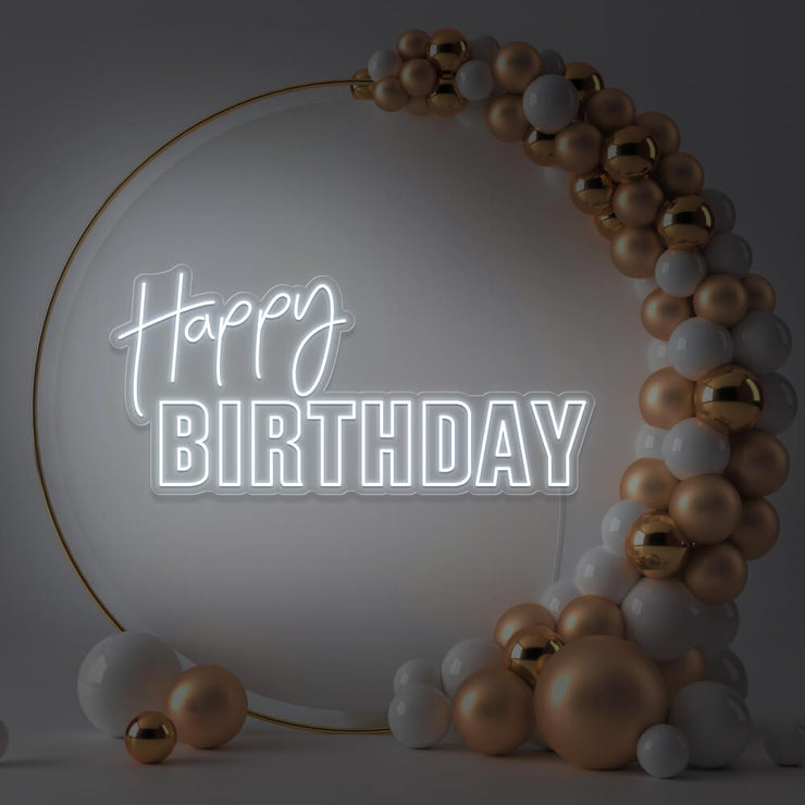 cold white happy birthday neon sign hanging inside gold hoop balloon backdrop