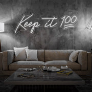 cold white keep it 100 neon sign hanging on living room wall