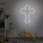 cold white cross neon sign hanging on kids bedroom wall
