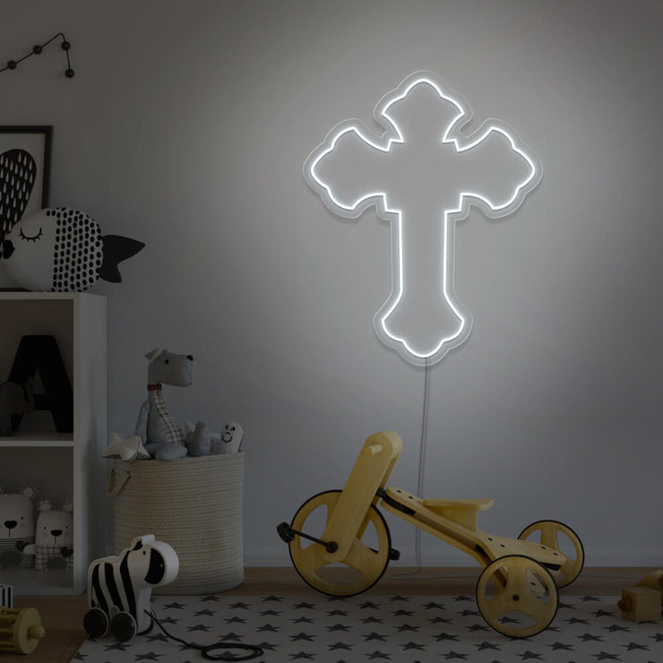 cold white cross neon sign hanging on kids bedroom wall